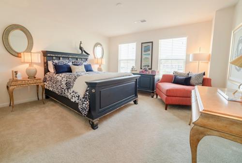 Unique Dark Navy Bedroom with Pops of Pink and Champagne